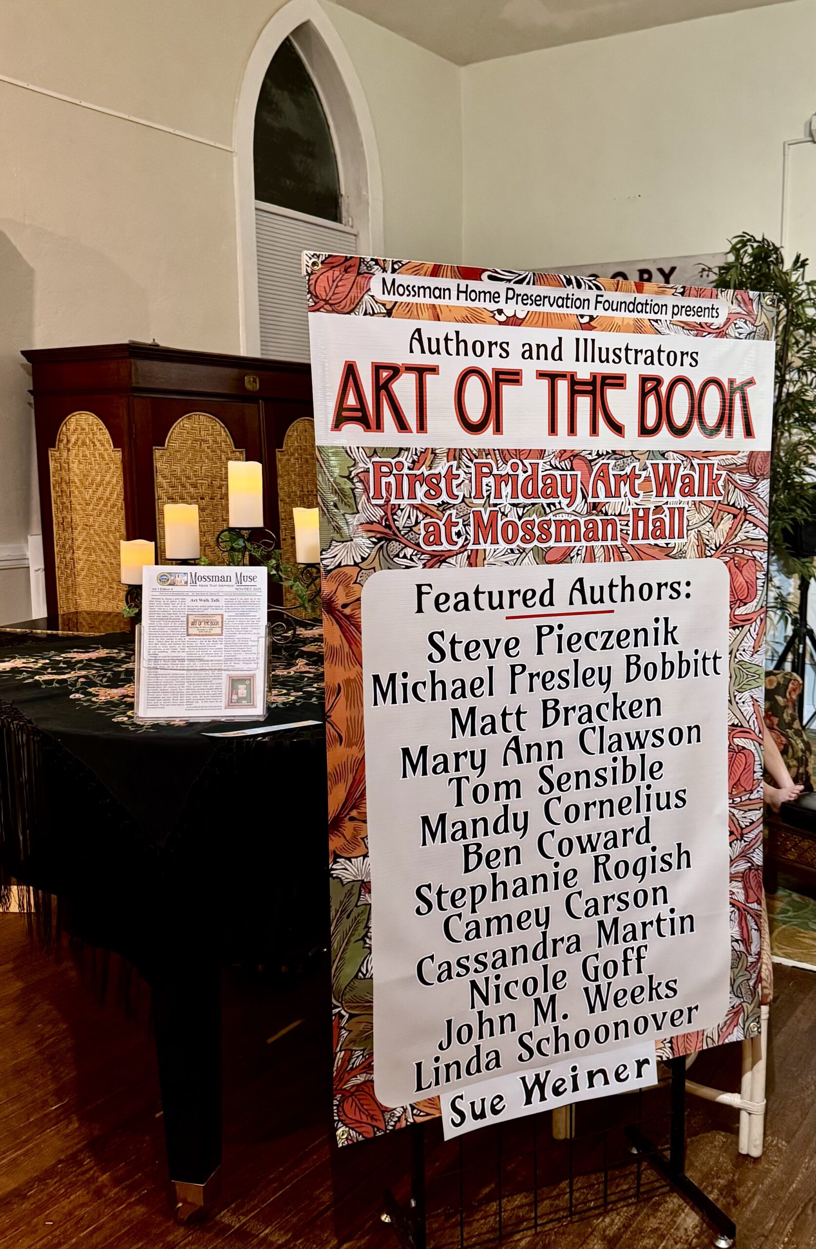 This is a picture of the sign advertising the Mossman Hall, "Art of the Book" exhibit on 11/7/25. Camey Carson is a featured author.